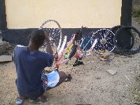 Sokode, Togo, mechanic repairing bicycle