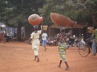 Vogan, Togo, Women head carry goods to the market