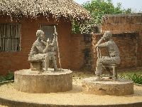 Togoville, statue of elder instructing boy