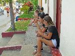 Tourist at Wi-Fi hotspot, near the Central Square, Vinales, Cuba