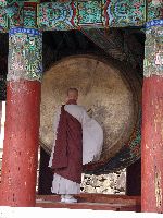 Monk drumming, bell / drum pavilion, Haeinsa Temple