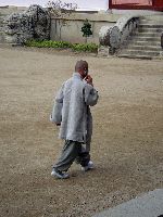 Monk using cell phone, Haeinsa Temple