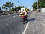 Bicyclist with big load, Haeman Gil, Gunsan, Korea