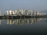 High rise residential towers reflect in the Han River, Korea