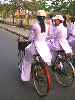 Veitnamese high school students on bicycles